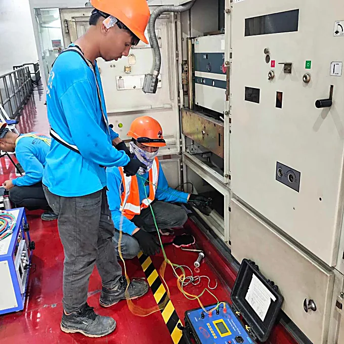 Bestcor crew testing switchgear in a plant room.